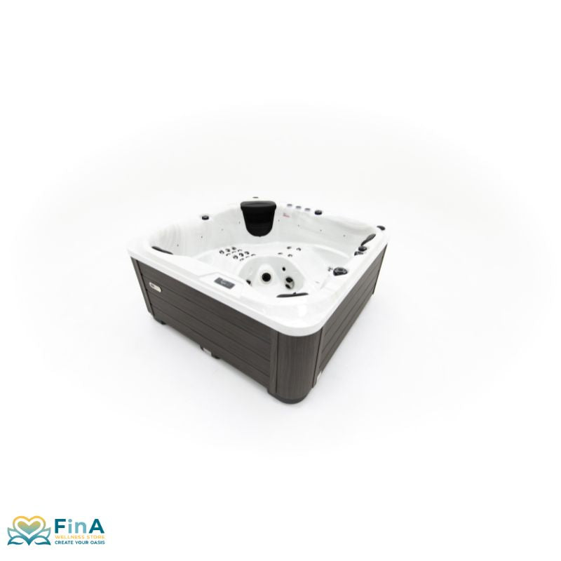 Hot tub Platinum Spas Happy Deluxe with 5 seats, modern surround and ergonomic loungers in the outdoor view.